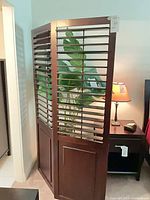 Angled view of full three-panel divider partially folded