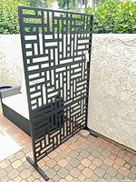 Front view of freestanding privacy screen showing cutout pattern and overall size