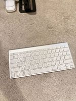 Top view of Apple Wireless Keyboard with partial trackpad visible