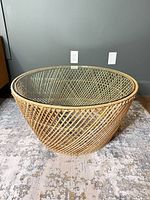 Full view of wicker coffee table and glass top