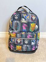 Front view showing character print, front pocket, mesh side pocket