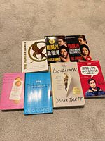 All seven paperback books front covers visible