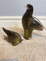 Both Marcolin bird figurines side by side