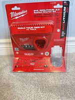 Front view of Milwaukee M12 REDLITHIUM 2.0 charger in retail blister pack