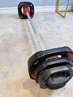 Full barbell assembled with plates and collars