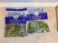 Front view of two SuperMoss preserved moss bags showing quantity and condition