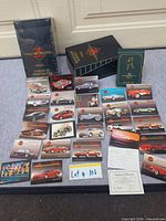 Front view showing sealed box, open sample binder, loose sample cards arrayed