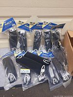Group of sealed N2N Mach 1 shin guard packages laid out showing quantity and packaging