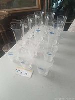 Full set of stemware and tumblers laid out on table