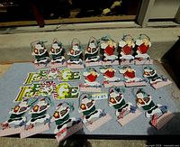 All 19 wooden holiday signs laid out, showing quantity and variety