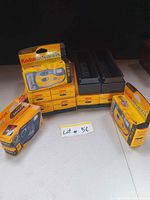 Lot overview showing three Kodak Advantix cameras in sealed packaging alongside six boxed Kodak Cavalcade slide trays