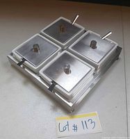Assembled condiment tray set with lids and spoons in place