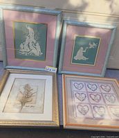 Group shot of all four framed artworks