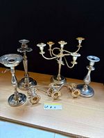 Group of candlestick holders on tabletop