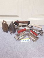Group shot showing all six vintage irons