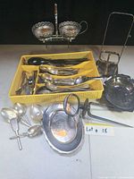 Full lot with basket of flatware, condiment stand, trays and fork
