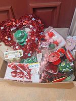 Box containing wreath, ribbons, packaged ornaments and accessories