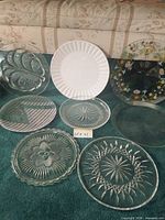 All eight serving trays arranged on carpet