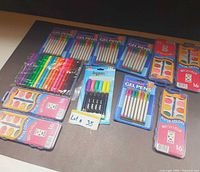 Overview showing packs of watercolors, gel pens, markers, highlighters