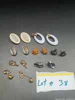 All seven pairs of clip-on earrings laid out for overview