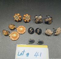 All six pairs of vintage clip-on earrings displayed