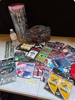 Overview of all packaged items on table including jumbo Jets pencils, Ravens speakers, assorted door hangers, memo pads and decals