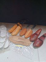 All items: three pairs wooden shoe stretchers and insoles