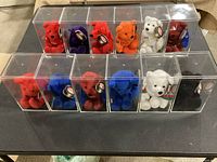 Front view of 12 bears in clear display cases