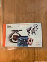 Front cover of Canada Post NHL 75th Anniversary stamp booklet in protective sleeve