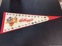 Full view of Kellogg's NHL logos pennant showing graphics and condition