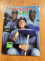 Front cover showing three Toronto Blue Jays players on Beckett Baseball Card Monthly August 1993 issue in plastic sleeve