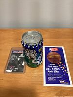 Sprite promotional can, Raptors schedule card, NBA All-Star ballot displayed on table
