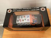 Factory-sealed Zamboni coin bank in original box showing limited edition marking and NHL logos