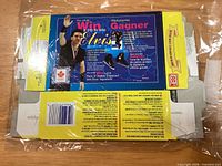 Interior print side of flattened popcorn box with Elvis Stojko contest details