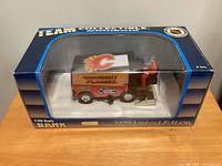 Boxed 1:24 scale Calgary Flames Zamboni bank showing team logo and limited edition labeling