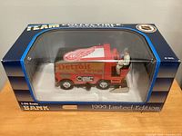 Front view of sealed 1999 Detroit Red Wings Zamboni bank in box