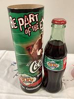 Bottle and tube showing labels, cap, graphics