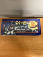 Sealed blue tin showing O-Pee-Chee 2002-03 NHL Hockey Cards graphics