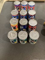 Top view of several cans showing silver lids with Pinnacle Inside logo