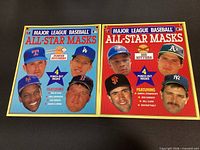 Front covers of both MLB All-Star Masks booklets