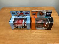 Both boxed Detroit Red Wings Zamboni die-casts, years 1998 and 2002, showing front packaging and graphics