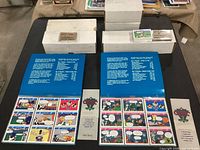 Open collector albums, storage boxes, loose cards visible