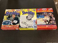 Front view of three Wayne Gretzky Post cereal boxes: Maple Shreddies, Shreddies, Spoon Size Shredded Wheat, standing side by side