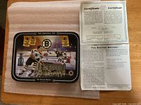 Front of collector plate with COA alongside