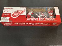 Front view of sealed McFarlane Detroit Red Wings three-pack box showing players and branding