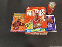 All four items grouped: Wheaties box, Valentines box, Coca-Cola can, NBA ballot