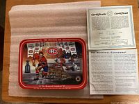 Front view of plate showing artwork and accompanying documents