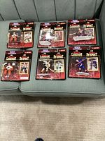 Six sealed Starting Lineup Canadian Legends Second Edition blister packs displayed on sofa
