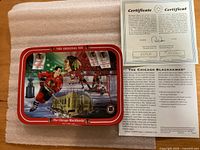 Front of plate showing artwork, red border, certificate beside