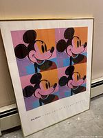 Front view showing entire framed print with four Mickey Mouse portraits